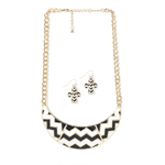 This statement necklace and earrings will tell the story of your great style! The golden chain necklace is inset with a dramatic black and white chevron collar, and the matching dangle earrings will hang just right as they drum up plenty of compliments.