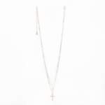 Two lovely crosses dangle from this gold-tone double chain necklaces that is sure to complement any outfit. A crystalline encrusted cross and a smaller metallic cross will capture the light as they showcase your faith.