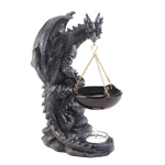 Ambiance and aroma will fill your room when you add a tealight candle and scented oil to this sensational oil warmer. A foreboding dragon perched atop boulders holds a black ceramic oil basin, hanging from gold-tone chains, and the beast’s scaly tail wraps around a glass tealight holder.