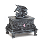 Worthy trinkets and treasures will be protected by this fearsome dragon. Whatever you keep in this intricately carved box, it will be guarded by a resting dragon on top and four fierce dragon faces at each corner of the base, surrounded by braided detail, medieval flourishes, and highlighted by two oblong pink jewels. 