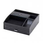 Keep your desk neat and orderly with this rich black faux-leather organizer. It features multiple storage compartments, including a pull-out drawer and covered section.